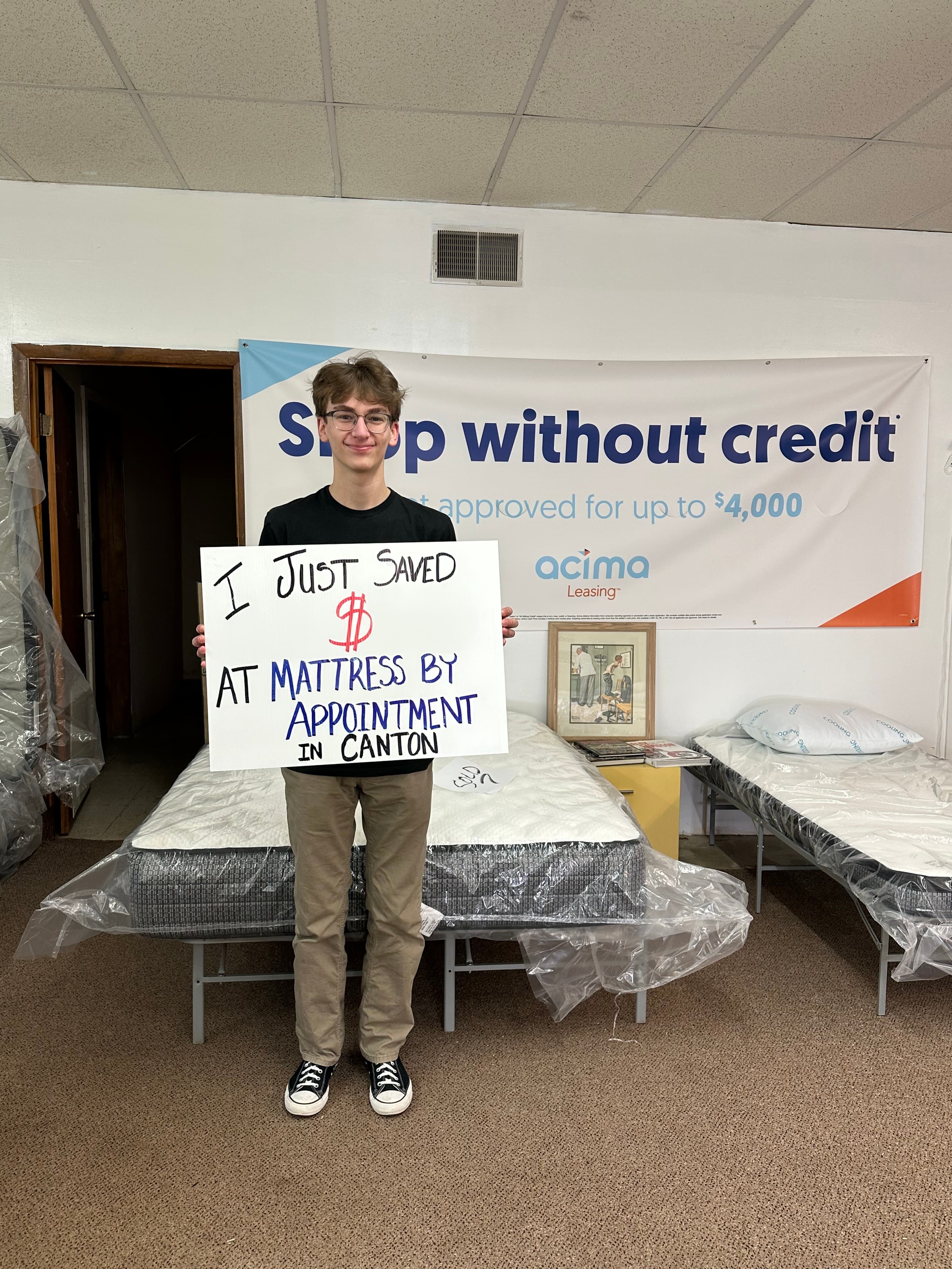 Happy customer with a new mattress from Mattress by Appointment Canton